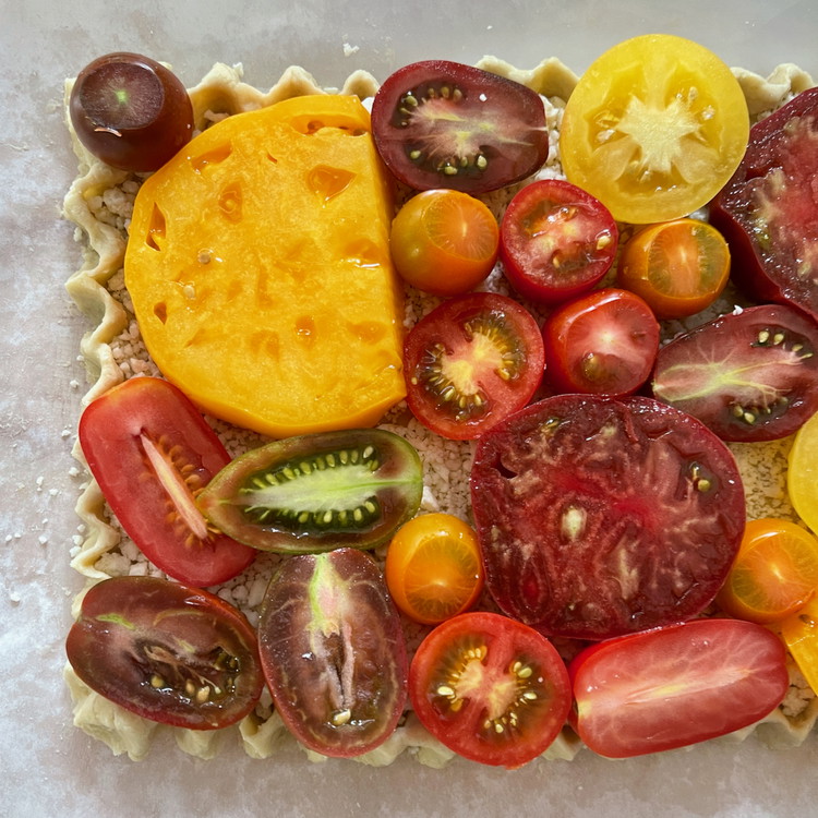 Image of Cut the medium sized tomatoes into 1” thick slices.  Small tomatoes can be cut in half or left whole if they are less than 1” thick.